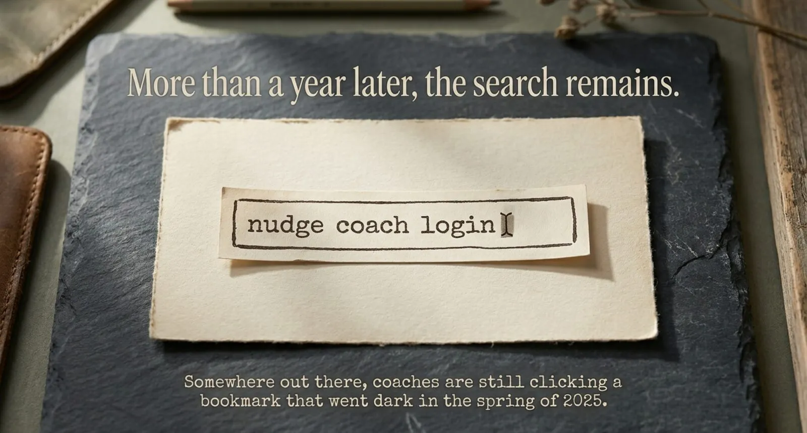 A paper scrap styled as a search field reading "nudge coach login" with a cursor, resting on slate under the line "More than a year later, the search remains."