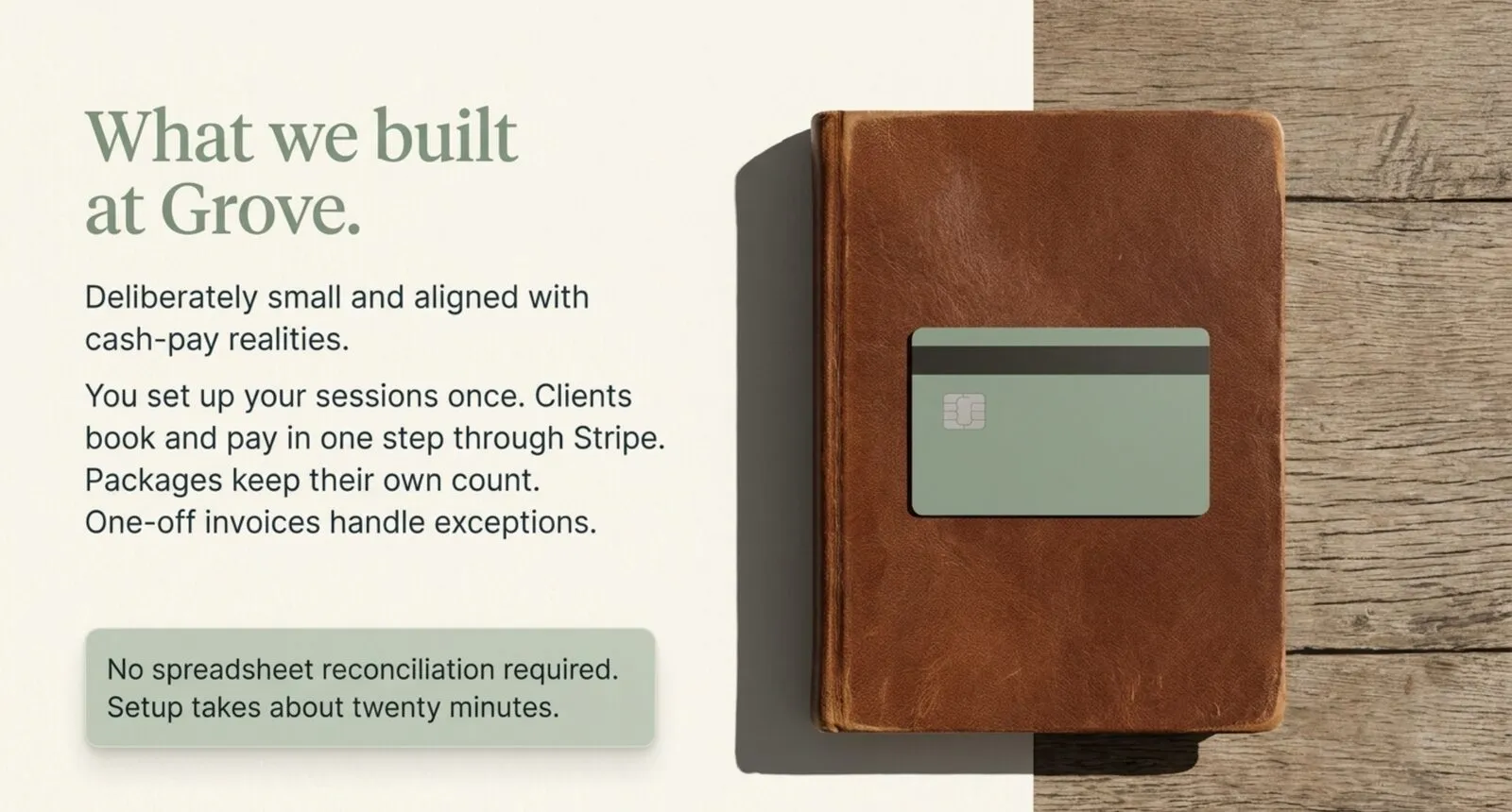 A worn leather ledger book closed on weathered wood with a single sage-green payment card resting on its cover